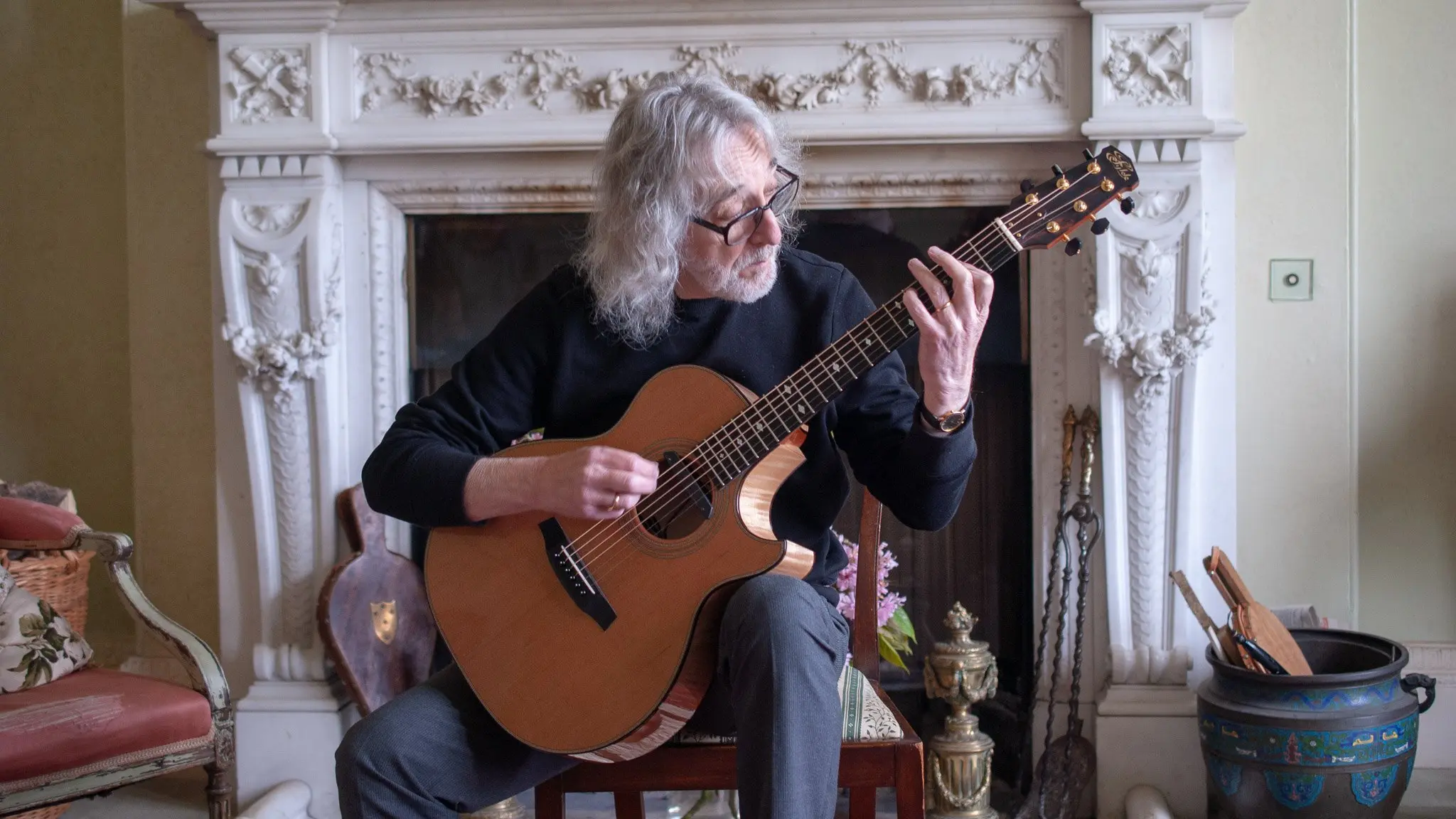 English guitar player Gordon Giltrap playing his Fylde guitar